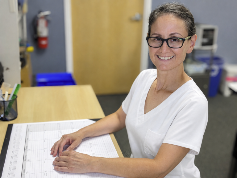 Maria Duran Occupational Therapist with White Scrubs